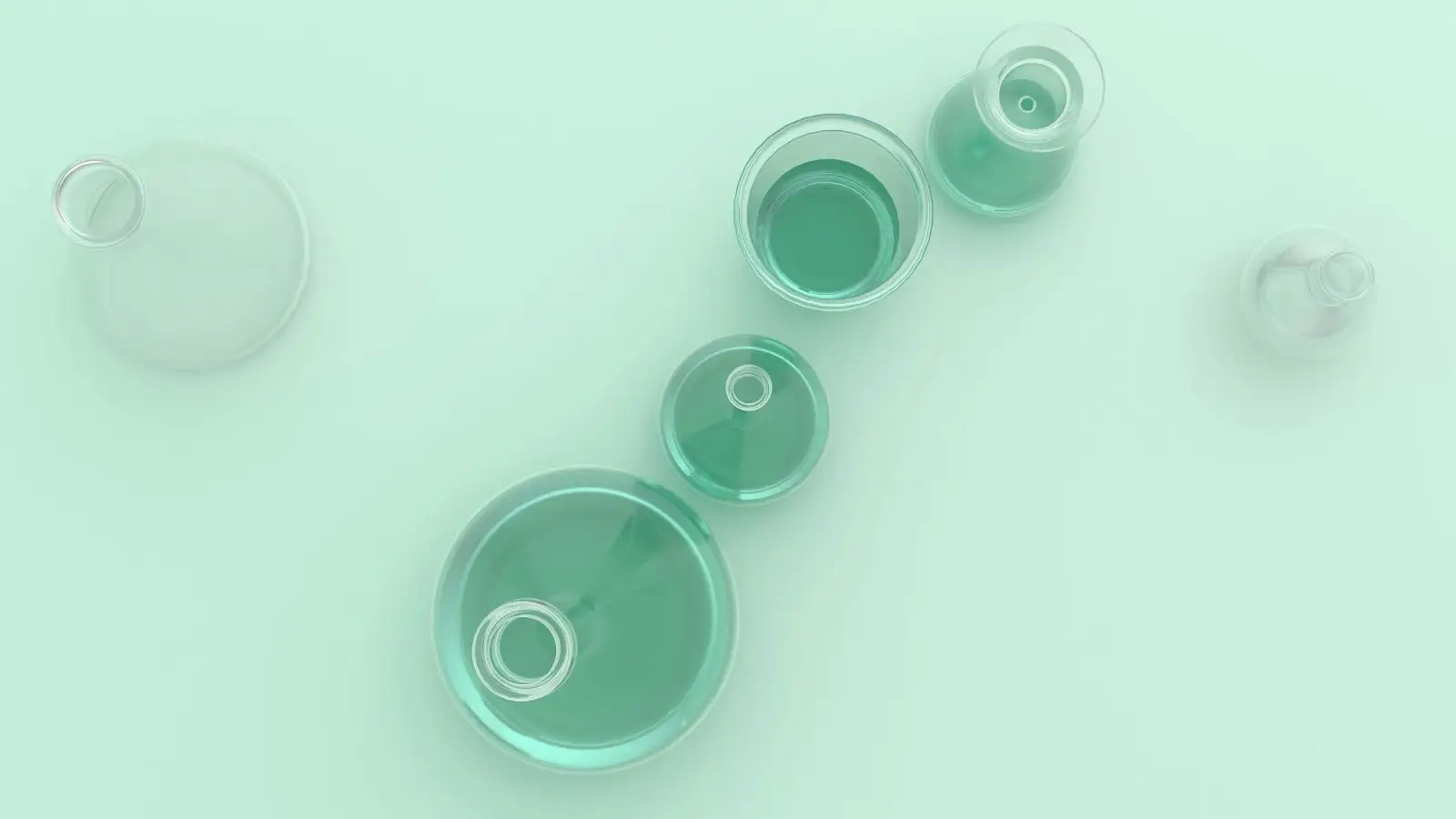 Laboratory glassware on a soft green background